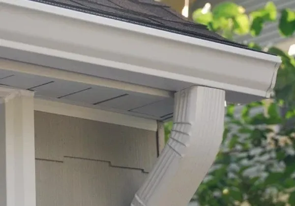 Custom formed seamless aluminum gutters and downspout system installed on a residential home exterior in the Twin Cities
