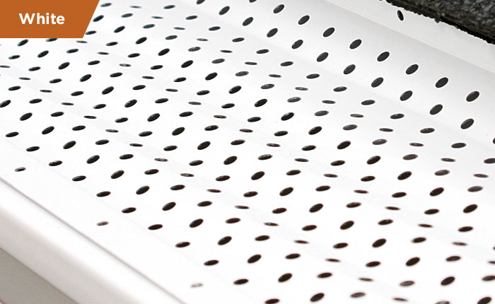 White aluminum gutter guard system sample featuring a slotted protective cover design