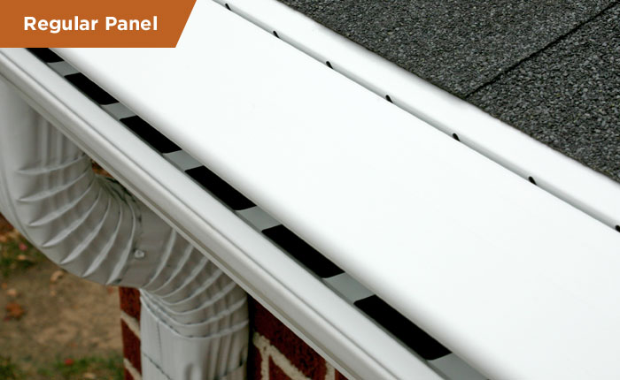 Regular panel aluminum gutter profile with a flexible corrugated downspout elbow installed on a residential roofline