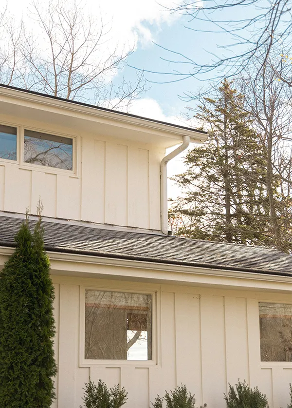 Custom formed seamless aluminum gutters and downspout system installed on a residential home exterior in Minneapolis